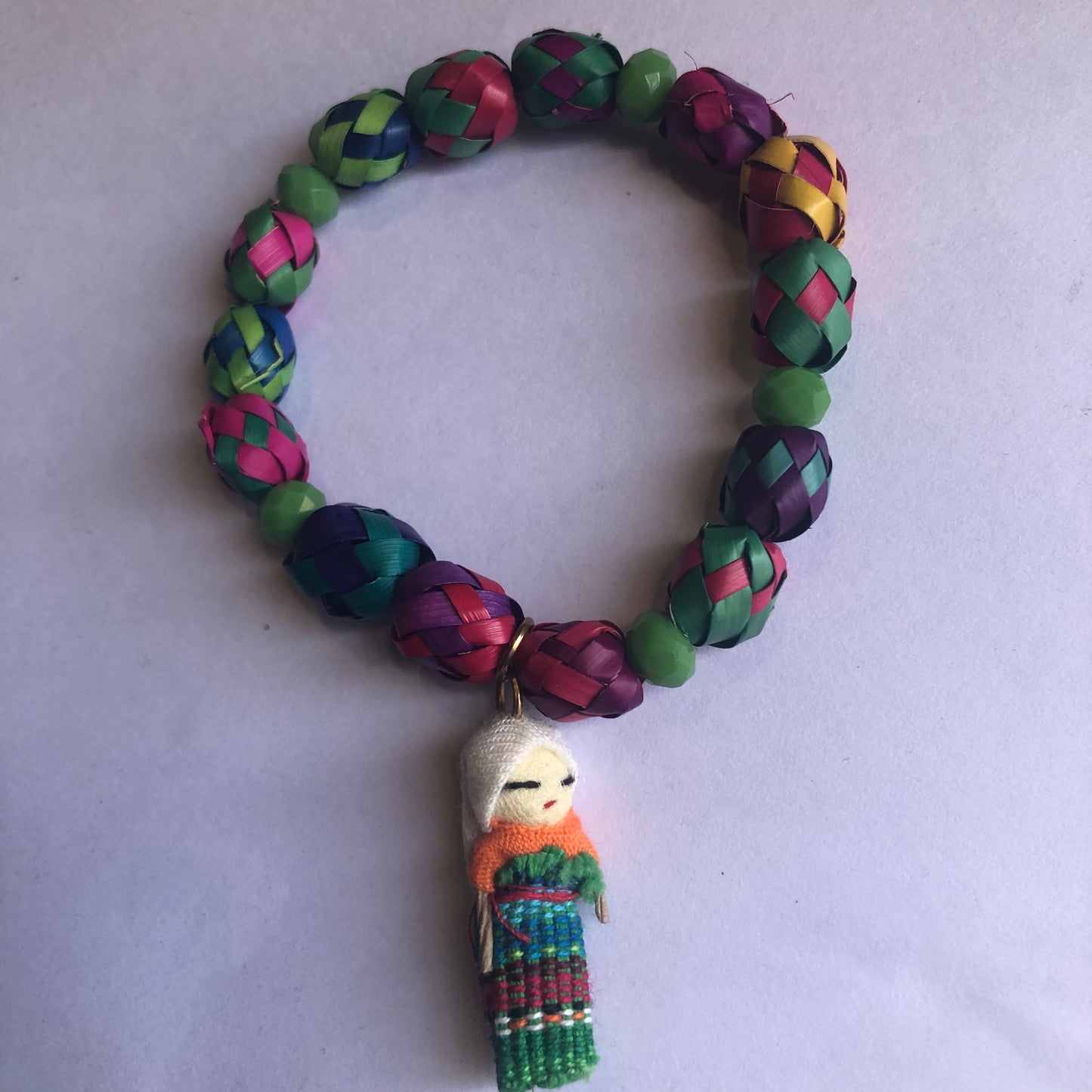 Palm leaf bracelet with worry doll charm